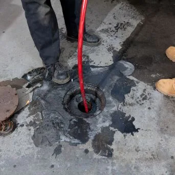 Clearing water from a leak point in a paved outdoor area